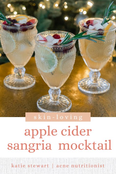 Apple Cider Sangria Mocktail Apple Cider Sangria Mocktail, Apple Cider Mocktail Non Alcoholic, Mocktail Sangria, Sparkling Water Mocktail, Acne Recipes, Sangria Mocktail, Holiday Sangria, Cider Sangria, Apple Cider Sangria