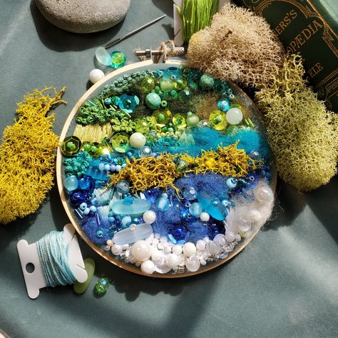 'Sea Smoke' Inspired by Carter's Beach located on the South Shore of Nova Scotia. This piece was created using colours from the sand, sky, seaweed and waters on the East Coast of Canada. 3D abstract embroidery using glass and acrylic beads, Gaspereau Valley Fibres, moss, velvet, felt, embroidery floss, sequins, sea glass, 5.5" embroidery hoop. Check it out at www.etsy.com/shop/wildwitchpotager Sea Glass Embroidery, Ocean Embroidery, Glass Embroidery, Sea Embroidery, Cute Embroidery Patterns, Abstract Embroidery, 3d Abstract, Felt Embroidery, Aesthetic Filter