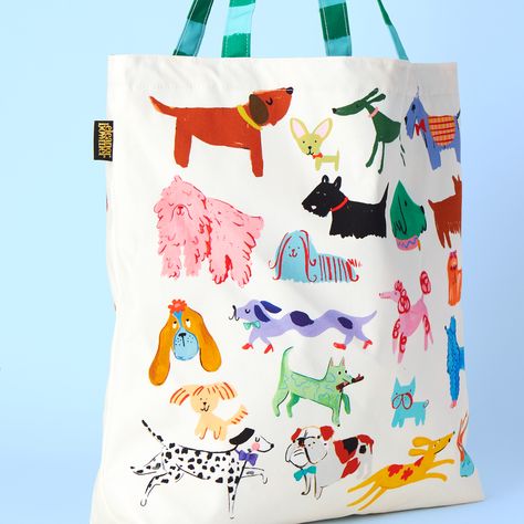 Carry your essentials in style with our Dog Club Tote Bag. Cream with cute dog illustrations, it features strong striped handles for durability. The inside boasts a pink and blue star pattern, while the water-resistant lining keeps your items safe. Ideal for dog lovers on the go. Product Specification: This bag is 50cm x 50cm Made in the UK 100% cotton. 300 grams. Half panama fabric. Iron inside out and wash at 30 degrees. Best Dog Gift Ideas, 30 Day Art Challenge, Kids Room Accessories, Dog Illustrations, Canvas Bag Design, Rene Gruau, Dog Club, Dog Tote Bag, Dog Tote