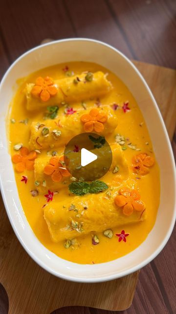 Pooja Savardekar on Instagram: "Mango Malai Rolls : Indulge in the lusciousness of summer with these Quick Mango Malai Rolls! Soft, creamy, and bursting with the flavor of fresh mango, they’re the perfect dessert to cool off and satisfy your sweet tooth. 🌞🥭 

Ingredients:

- 1 cup milk
- 2-3 tbsp sugar
- 2 tbsp custard powder
- 1/2 cup mango pulp
- Saffron milk
- 1/4 cup paneer
- 1/4 cup malai or cream
- 2 tbsp powdered sugar
- 6 slices of bread
- Mango pieces
- Chopped nuts

1. Custard - Boil 1 cup milk, add 2-3 tbsp sugar. Mix 2 tbsp custard powder with milk, pour into boiling milk, cook for 30 secs. Cool, then mix in 1/2 cup mango pulp and saffron milk. Set aside.

2. Malai Mixture - Blend 1/4 cup paneer and 1/4 cup malai or cream until smooth. Mix in 2 tbsp powdered sugar.

3. Rolls Mango Pulp Dessert, Paneer Dessert Recipes, Mango Custard, Saffron Milk, Pulp Recipe, Mango Pulp, Mango Dessert, Custard Powder, Slice Of Bread