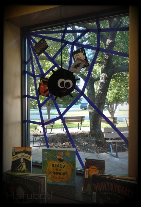 One of the actual Halloween book displays before it got loaded with even more items. Halloween Classroom Window Display, October Window Display Classroom, Halloween Decorations For Library, Halloween Library Decor, Library Halloween Displays, Halloween Library Decorations, Window Decoration Ideas For School, Library Halloween Decorations, Halloween Library Displays