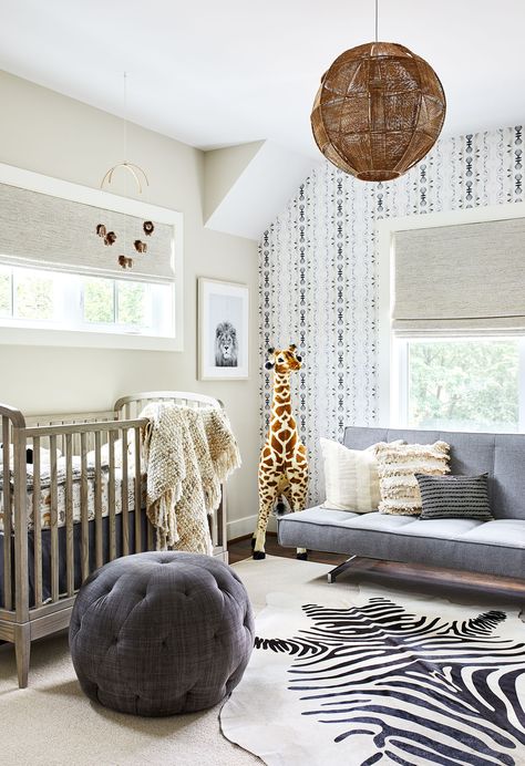 Cozy nursery with zoo influence. The wood crib sits adjacent from the modern futon and is complimented by a zebra rug, toy giraffe and animal art. Bedroom Wallpaper Neutral, Room With Futon, Safari Baby Room, Bedroom Wallpaper Accent Wall, Neutral Nursery Ideas, Futon Living Room, Futon Decor, Nursery Accent Wall, Wallpaper Neutral