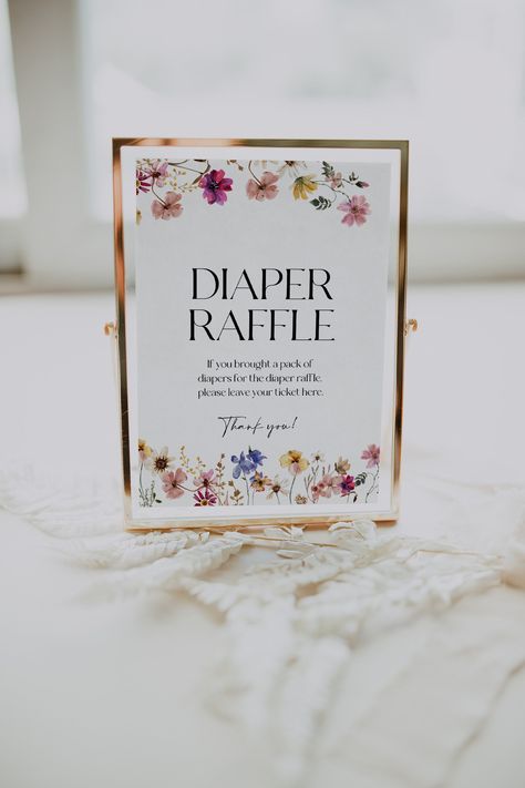 Baby shower Diaper Raffle sign template with colorful flowers and wildflowers. Instant access through Templett, fully customizable, no software needed.  Check the demo and coordinating templates using the links below. Ⓜ️ MATCHING TEMPLATES:  https://etsy.me/3CqImOr (copy the link in a web browser) 📦WHAT IS INCLUDED: Diaper raffle sign: 5x7 and 8x10 inches 💻 DEMO LINK: https://templett.com/design/demo/visual/20922467,20922468 🖨️ PRINT using our partner's reliable printing service:  https://bit Flower Baby Shower Theme, February Baby Showers, Diaper Raffle Sign, Wildflower Baby Shower, Baby In Bloom, Elegant Baby Shower, Sprinkle Baby Shower, Summer Baby Shower