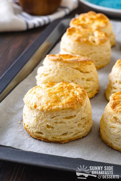 Golden cat head biscuits on a baking sheet. Biscuits For Two, Cat Head Biscuits, Chicken Pot Pie Filling, Golden Cat, Southern Breakfast, Pot Pie Filling, Southern Biscuits, Comfort Food Southern, Homemade Biscuits