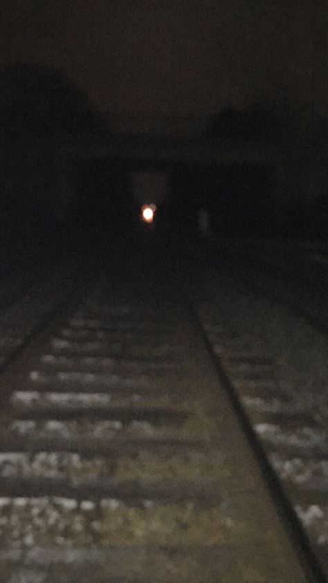 Train Tracks at night with a train light in the distance | Photograph by Yolanda Stape Off The Rails Aesthetic, Train Tracks At Night, Night Train Aesthetic, Train Tracks Aesthetic, Train At Night, Train Night, Midnight Walk, Train Light, Dark Forest Aesthetic