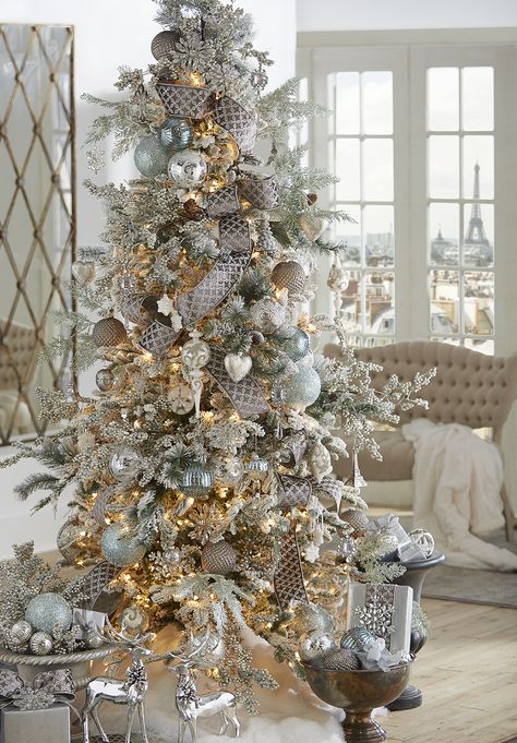 SILVER-TINGED SHIMMER WITH SOFT BLUE HUES AND EIFFEL TOWER VIEWS Raz Imports Christmas Trees, Raz Imports Christmas, Glam Christmas, Elegant Christmas Trees, A White Christmas, Christmas Tablescape, Christmas Tree Inspiration, Flocked Christmas Trees, Trendy Tree