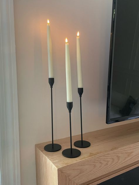 Candles On Tv Stand, Candle Stick Decor Ideas, Mantle With Tv, Candle Holders Decor Ideas, Black Candle Holders, Candle Stick Decor, Tv Stand Decor, Living Room Redo, Tall Candle