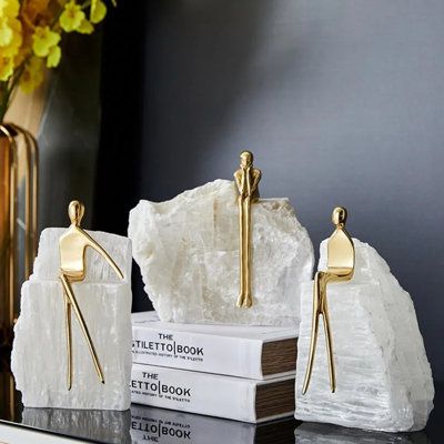 Home base accessory (3 guy sitting on an iceberg) set (3-piece) is a lightweight, gold accessory for the living room, bedroom and study room. | Everly Quinn 3 of Pieces Vergil Sculpture Set White/Yellow 7.0 x 5.0 x 8.0 in, Metal | Home Decor | C008974461 | Wayfair Canada