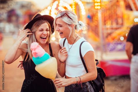 Stock Image: Shot of happy female friends in amusement park eating cotton candy. Two young women enjoying a day at amusement park. Eating Cotton Candy, Ying Yang Twins, Amusement Park Outfit, Big And Rich, Thrill Ride, Cruise Port, Park Photos, State Fair, Female Friends