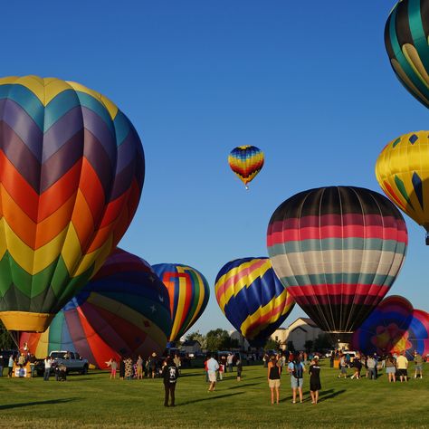 Hot air balloons fill the sky in Riverton, Wyoming for the Riverton Rendezvous in July. Riverton Wyoming, Travel Wyoming, Balloon Glow, Wyoming Travel, Colorful Balloons, Historical Reenactment, The Cowboy, Our Town, Colourful Balloons