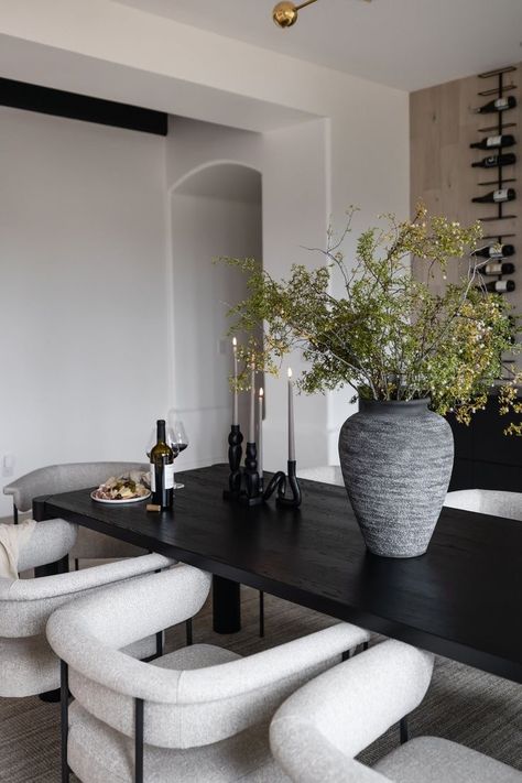 Edgy Dining Table, Dining Table Centerpiece Plant, Coasters On Dining Table, Organic Modern Dining Room Black Table, Organic Modern Black Dining Table, White And Oak Dining Table, Dining Room Table Bench And Chairs, Dining Room With Black Floors, Black Table With White Chairs