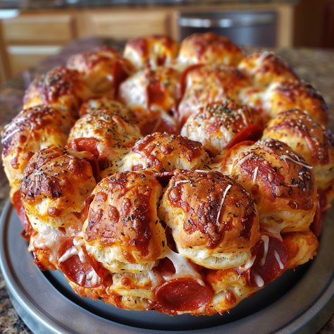 🍕 Fun and flavorful: Pizza Monkey Bread! Pull apart and enjoy! #PizzaPullApart Pizza Monkey Bread Ingredients: Refrigerated biscuits Pepperoni slices Mozzarella cheese, cubed Marinara sauce Italian seasoning Instructions: Cut biscuits, stuff with pepperoni and cheese. Layer in a bundt pan, sprinkle with seasoning. Bake until golden. 🍕🧀 Dive into this cheesy, gooey delight. Great for parties or a family night! Tag us with #MonkeyBreadMagic! Bread Pull Apart, Pizza Monkey Bread, Pepperoni And Cheese, Bread Pull Apart Recipes, Gourmet Food Plating, Twisted Recipes, Bread Ingredients, Trending Recipes, Monkey Bread