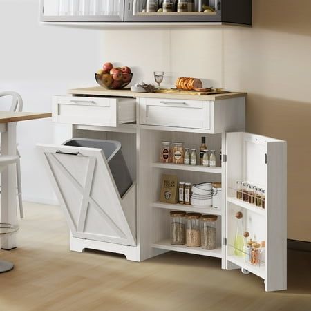 Specifications: Color: White Size: 10 Gallon Material: Solid Wood top + MDF Drawer Quantity: 2 Door Quantity: 2 Adjustable Shelf: Yes Opening Mechanism: Tilt Out Finish Type: Polished Dimension: 14.17"D x 39.37"W x 37.4"H NOTE: The deliver package does not included trash Can. Package Includes: 1 x Kitchen Trash Cabinet 1 x Set of Accessories 1 x Instruction Size: 10 gal. Cabinet Ideas For Kitchen Small Spaces, Kitchen Cabinet Trash Pullout, Extra Storage In Kitchen, Tilt Out Trash Can Cabinet, Tilt Out Trash Can, Can Cabinet, Trash Cabinet, Corner Coffee, Trash Can Cabinet