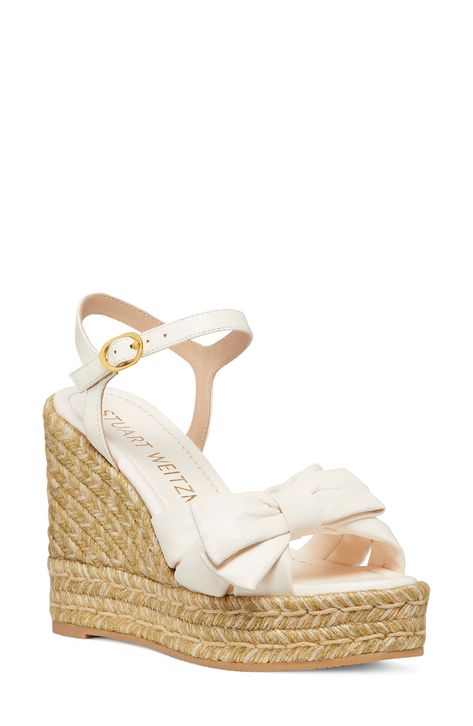 A soft leather bow sweetens a beachy ankle-strap sandal lifted by a jute-wrapped platform and integrated wedge heel. 3 3/4" heel; 1" platform Adjustable ankle strap with buckle closure Leather upper/synthetic lining/synthetic sole Made in Spain Wedged Heel Sandals, Wedges Aesthetic, Beachy Heels, Vacation Heels, Sandles Heels, Beach Heels, Hoco Heels, Sandle Heels, Rhinestone Wedges