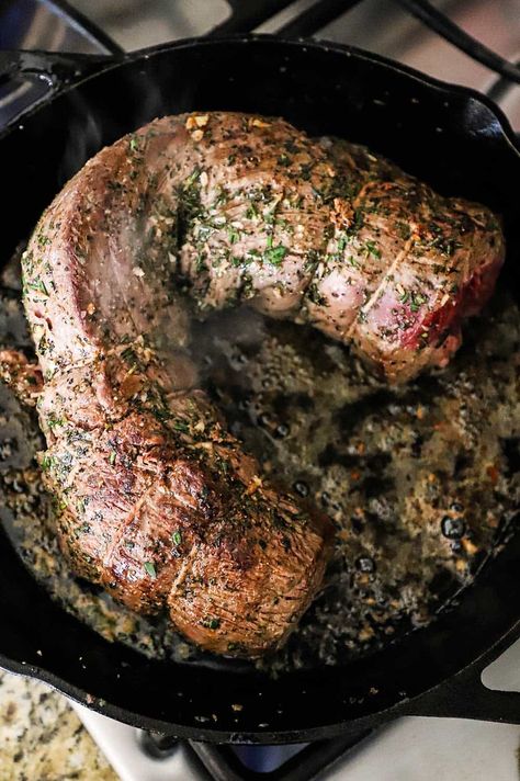 A large beef tenderloin roast that has been seared in a large black cast-iron skillet. Beef Tenderloin Crostini, Tenderloin Crostini, Wine Cream Sauce, Beef Tenderloin Recipes, Beef Tenderloin Roast, Flank Steak Recipes, Tenderloin Roast, Tenderloin Recipes, Half Baked Harvest