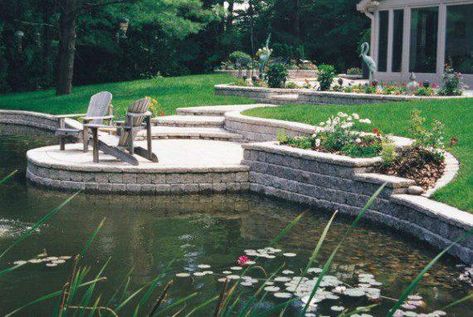 stone retaining wall around pond - Landwork Contractors Built In Pool, Lakeside Landscaping, Patio Retaining Wall, Small Lake House, Pool Landscape Ideas, Pond Landscape, Island Garden, Stone Retaining Wall, Backyard Pond