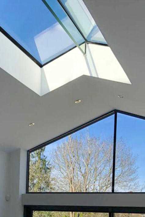 A ridge rooflight to a modern glazed extension Glazed Extension, Pitched Roof Window, Sliding Roof, Cottage Extension, Roof Skylight, Butterfly Roof, Side Extension, Roof Extension, Roof Trusses