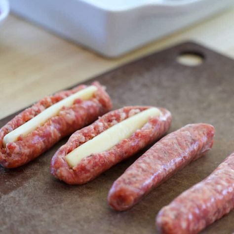 string cheese stuffed sausages getting cut open and cheese inserted before cooking Cheese Stuffed Bratwurst, Sausage With Cheese Stick, Italian Sausage With Cheese Sticks, Stuffed Bratwurst, Cheese Stuffed Sausage, String Cheese Recipes, Sausage Ideas, Italian Sausage Links, Stuffed Sausage