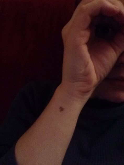 Small brown heart "birth mark" tattoo Heart Birthmark Aesthetic, Tattoo Over Birth Mark, Brown Heart Tattoo, Cool Birth Marks, Heart Beauty Mark Tattoo, Small Heart Freckle Tattoo, Heart Birthmark, Birth Marks, Tiny Tats