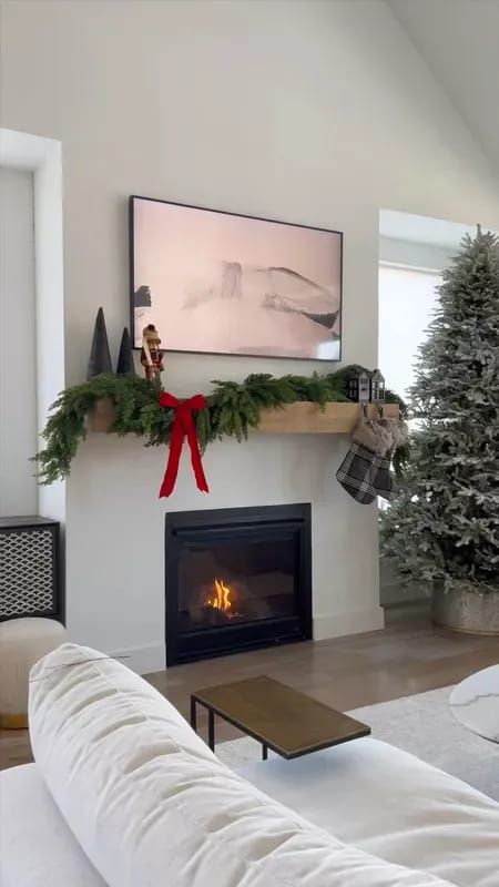 Decorating our mantel for the holidays! I used four of the cedar garlands and fluffed the branches a bit. Then added these metal stocking holders, tartan stockings, wooden trees and the cutest nutcracker #LTKsalealert #LTKstyletip #LTKHoliday Decor On Fireplace Mantel, Christmas Decor On Fireplace, Stocking Display No Mantle, Stockings With No Fireplace, Hang Stockings Without Fireplace, How To Hang Stockings With No Fireplace, Stockings Without Fireplace, Decor On Fireplace, Stocking Hooks Mantle