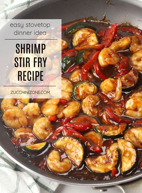 Shrimp stir fry recipe by Zucchini Zone. Shrimp stir fry is a quick and easy dinner recipe that you can have on the table in about 20 minutes! Juicy shrimp, zucchini, and bell pepper are coated in a sweet and savory homemade sauce that's served over steamed rice. #shrimpstirfry #stirfry #20minutemeal #dinnerideas #weeknightmeals Shrimp Green Beans Stir Fry, Shrimp And Zucchini Stir Fry, Shrimp Stir Fry Recipe, Shrimp And Zucchini, Zucchini Stir Fry, Stir Fry Shrimp Recipes, Shrimp Zucchini, Seafood Dinners, Shrimp Stir Fry