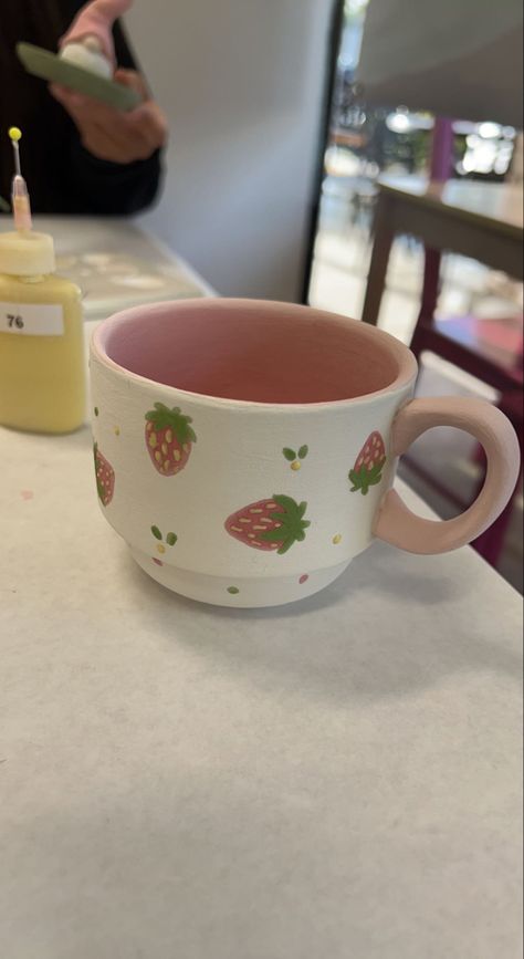 #colormemine #strawberries #strawberrycup #handpaintedstrawberries #colormemineideas #paintyourownpottery #paintingartideas #paintingforbeginners #paintideas #dateideas #giftideas #paintedcup Pretty Ceramic Mugs, Strawberry Mug Painting, Things To Paint On Ceramics, Color Me Mine Strawberry, Strawberry Mug Pottery, Paint A Cup Ideas, Paint Me Mine Ideas, Ceramic Plate Design Ideas, Strawberry Painted Mug