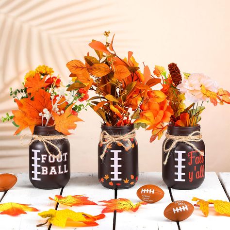 PRICES MAY VARY. Football Fall Decorations: our fall football table centerpieces cannot be overstated; This package includes 3 pieces of football themed mason jars with matching 3 pieces of stickers; Designed with a blend of football and fall elements, these jars are sure to enrich your fall festivities or football themed parties Accurate Size with an Athletic Touch: each fall football mason jar is crafted with meticulous attention to detail, measuring around 4.7 inches in height and 3.1 inches Football Table Centerpieces, Fall Decor Ideas For Office Desk, Football Centerpiece Ideas, Football Mason Jars, Office Fall Decorations Ideas, Fall Football Decor, Destiny Wedding, Carnival Centerpieces, Football Centerpieces