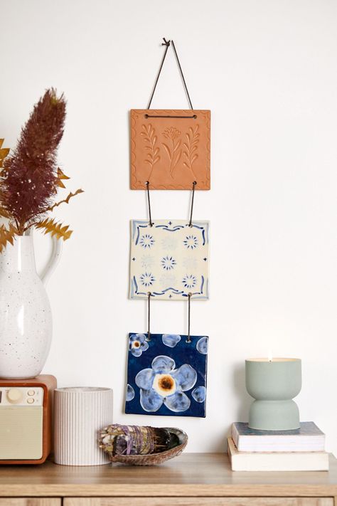 Tiered Ceramic Tile Wall Hanging | Urban Outfitters Australia Official Site Ceramic Tile Wall, Clay Wall Hanging, Wood Shoe Rack, Tile Crafts, Cerámica Ideas, Ceramic Wall Art, Hanging Flower Wall, Clay Wall, Tile Wall