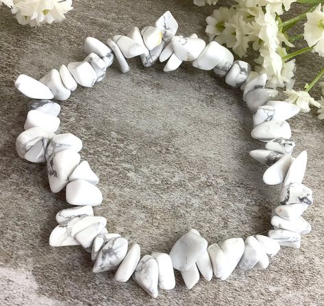 ✦Gemstone: Howlite ✦Color: white ✦Shape: Chips ✦Length: 5''-7'' ✦QTY: 1 pcs / package ✦✦Please measure your wrist size, then order your balance. White Howlite Chips Beaded Bracelet, healing protection balancing stretchy gemstone bracelet gift for women and men Howlite is an aid to insomnia, especially when caused by an overactive mind. ... Howlite strengthens memory and stimulates desire for knowledge. It teaches patience and helps to eliminate rage, pain and stress. A calming stone, Howlite cal White Stone Bracelet, Chip Bracelet, Healing Gemstone Bracelets, Reiki Jewelry, Amazonite Bracelet, Crystal Healing Bracelets, Moonstone Bracelet, White Howlite, Chip Beads