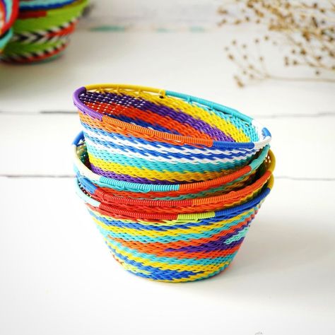 #madeinsouthafricawithlove are handwoven by Zulu crafters, combining traditional skills with modern materials. Most bowls are woven from the bottom up whereas with wire weaving it is done from the top down. These inventive weavers start with a thick wire at the top rim of the basket and then work their way down, pulling each wire taut against a form to create the shape of the bowl. Perfect as an accent piece in home decor, ideal storage for various items like jewellery and keys or a thoughtfu... Multicolor Handwoven Bangle Jewelry, Textile Coiled Basket Diy, Woven Spiral Bowl, Woven Bowl, Handwoven Multicolor Basket Bag, It Is Done, Way Down, Zulu, Wire Weaving