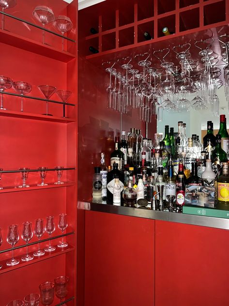 The Pistachio Green Kitchen Isn’t the Only Statement Feature Inside This LA Home | Architectural Digest Pistachio Green Kitchen, Hidden Bar Cabinet, Chrome Candle Holders, Red Cabinets, Hidden Bar, Red Bar, Home Bars, Home Decor Brand, Home Stay