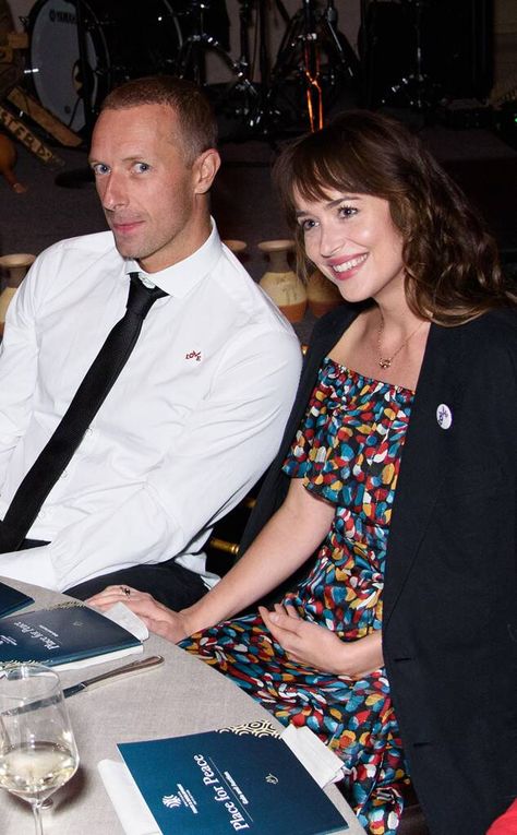 Dakota Johnson & Chris Martin from The Big Picture: Today's Hot Photos  The two attend the Place for Peace event together. Dakota Johnson And Chris Martin, Coldplay Singer, Coldplay Concert, Chris Martin, 15th Anniversary, Alain Delon, Celebrity Tattoos, Christian Grey, George Clooney