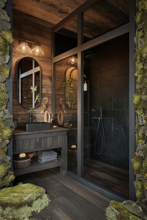 Bring the essence of a luxury forest cabin into your bathroom with dark oak details and a stunning black stone shower. Nature meets sophistication. #ForestInspired #LuxuryBathroom #NaturalDesign Dark And Moody Master Bathrooms, Moody Bathroom Inspiration, Dark Bathroom With Wood, Cozy Dark Bathroom, Black And Wood House Interior Design, Moody Spa Bathroom, Moody Master Bath Inspiration, Dark Naturalism House Interior, Dark Cabin Interior