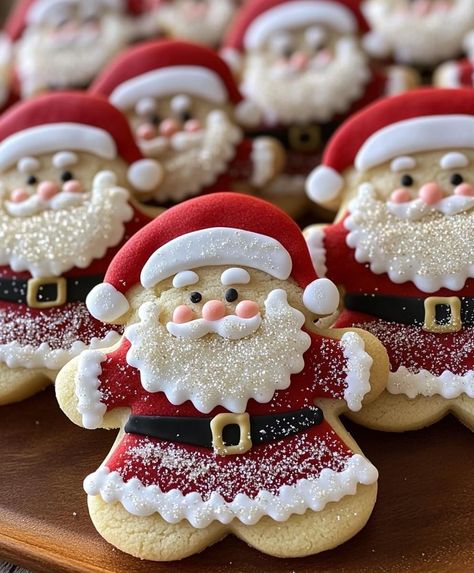 Christmas Santa Suit Sugar Cookie Cutouts

Ingredients:

2 1/2 cups all-purpose flour
1 teaspoon baking powder
1/2 teaspoon baking soda
1/2 teaspoon salt
1 cup (2 sticks) unsalted butter, softened   
1 cup granulated sugar
1 large egg
1 teaspoon vanilla extract
For decorating:

Royal icing (red and white)
Food coloring (red and green)
Black food coloring gel
Small candy eyes
Red sugar sprinkles
Instructions:

Make the dough: In a large bowl, whisk together the flour, baking powder, baking soda, and salt.
Cream the butter and sugar: In a separate bowl, cream together the butter and sugar until light and fluffy.
Combine wet and dry ingredients: Beat in the egg and vanilla extract. Gradually add the dry ingredients to the wet ingredients, mixing until just combined.
Roll and cut: Roll out the Santa Cookies Decorated, Sugar Cookie Cutouts, Christmas Cutout Cookies, Cookie Gingerbread, Xmas Cookie, Christmas Cutouts, Santa Suit, Santa Cookies, Xmas Cookies