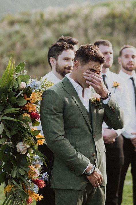 These two had the perfect spring-inspired wedding at Jumanji at Kualoa Ranch! The bride’s two-piece wedding dress was ethereal and romantic, the groom’s suit was the perfect spring sage green tone, and the florals were the perfect assortment of tropical and local flowers. Spring wedding inspiration, Spring wedding floral arrangements, spring mismatched pastel bridesmaids dresses, Hawaii tropical wedding, luxury Hawaii wedding photographer, romantic tropical luxury wedding ceremony inspiration Groom Outfit Garden Wedding, Wedding Groom Green Suit, Garden Groomsmen Attire, Eucalyptus Wedding Groom, Romantic Groom Attire, Green Groom Wedding Party, Garden Party Suit Men, Groom Suits Green, Groom Different Color Than Groomsmen