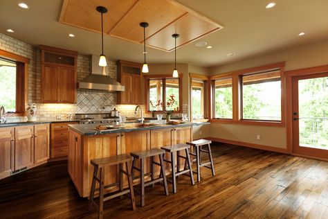 These natural wood cabinets highlight the inherent beauty of the handscraped hardwood floors that make this kitchen feel warm and cozy. Imitate the look you see here by installing the Johnson Hardwood Tuscan line in the color Toscana in your home. Oak Wood Floors Kitchen, Oak Wood Trim, Painted Kitchen Cabinets Colors, Wood Floor Kitchen, Kitchen Remodel Cost, Textured Wood, Oak Kitchen Cabinets, Oak Wood Floors, Rustic Flooring