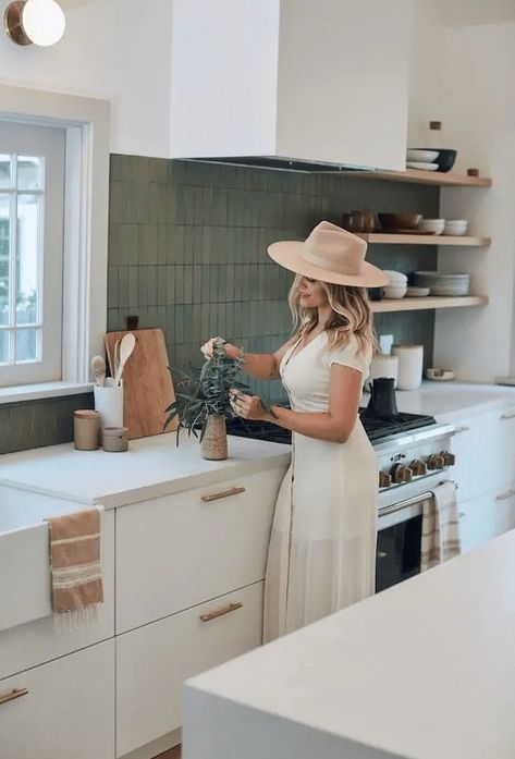 a pretty modern kitchen in white, with white countertops, a matte green stacked tile backsplash and open shelving California Modern Kitchen Design, Kitchen Inside Outside, California Bungalow Kitchen, 70s Kitchen Modern, California Cool Kitchen, California Kitchen Design, California Kitchen Style, California Style Kitchen, California Bungalow Style Interiors