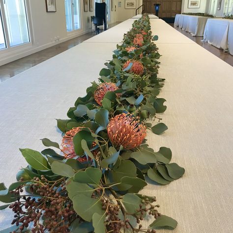 Gum Foliage, Gum Nuts and Leucospermum Table Runner Table Florals, School Dinner, Gum Leaves, School Dinners, Xmas Table, Wedding Vision Board, Long Table, Wedding Vision, Big Party