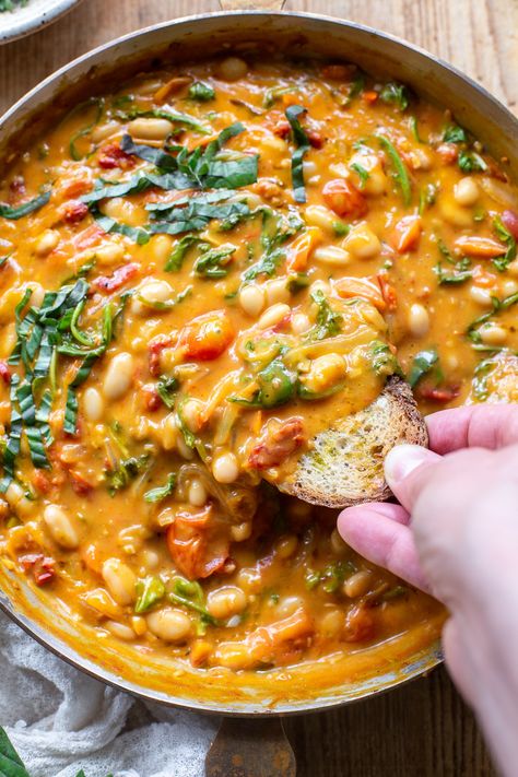 The comforting flavors of this Creamy Vegan Tomato White Bean Stew make the perfect easy lunch or dinner. This dairy-free & plant-based recipe is packed with wholesome ingredients, like protein-packed white beans, cherry tomatoes, and nutrient-dense greens. Learn how to make this easy and satisfying vegan stew in just 25 minutes. Tomato White Bean, White Bean Tomato, White Bean Stew, Vegetarian Stew, Vegan Stew, Beans Curry, Bean Plant, Tomato Sauce Recipe, Baked Vegetables