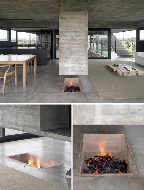 A Concrete Divider Hangs Above An In-Floor Fireplace Inside This Home Fireplace Concrete, Floor Fireplace, Concrete Room, Plan Furniture, Hanging Fireplace, Sunken Fire Pits, A Modern House, Sunken Living Room, Architecture Design Concept