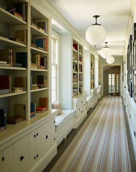 Hallway lined with bookcases, striped runner Long Corridor, White Bookshelves, Round Ceiling, Hallway Design, Long Hallway, Bookshelf Design, Rug Round, Hallway Storage, Ceiling Lamps