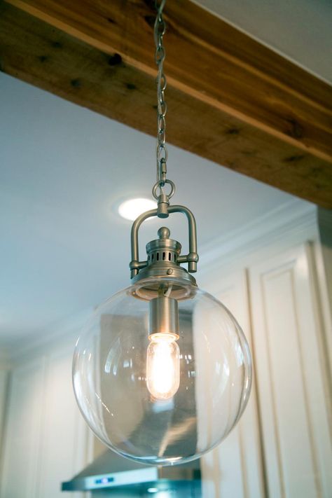 Globe+light+fixtures+illuminate+the+breakfast+bar+in+the+kitchen.+ Wood Coffee Table Rustic, Fireplace Room, Chip And Jo, Hgtv Fixer Upper, Diy Pendant Light, Magnolia Farms, Globe Light, Magnolia Market, Light Hanging