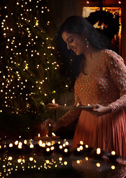 Young woman arranging oil lamps at a diwali festival Business Collaboration, Diwali Pooja, Diwali Photography, Diwali Pictures, Diwali Photos, Portrait Photography Tips, इंस्टाग्राम लोगो, Diwali Images, Saree Poses