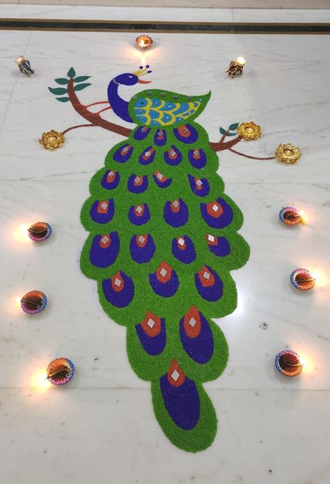 Peacock Rangoli for diwali #rice Rangoli Designs With Rice, Peacock Rangoli Design, Peacock Rangoli, Rangoli Design, Rangoli Designs, Diwali, Crochet Earrings, Rice, Novelty Christmas