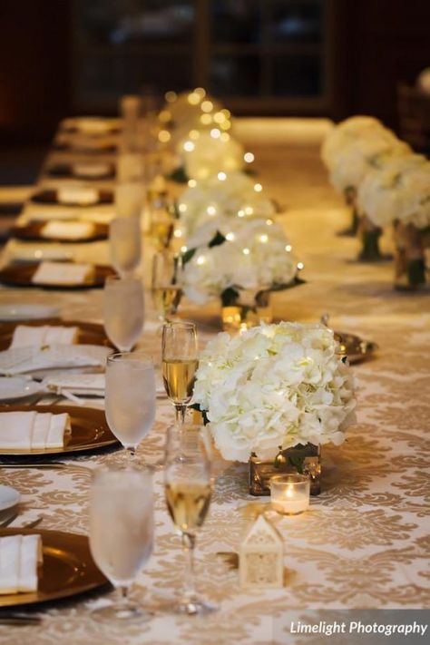 centerpieces cubes with white hydrangea and fairy lights Flowers by Fudgie Sarasota wedding and event florist Limelight Photography Floral Centerpieces With Fairy Lights, Twinkle Light Flower Centerpiece, Fairy Lights Wedding Centerpieces Flower, Fairy Light Centerpiece Wedding, Fairy Light Centerpiece, Cream Wedding Flowers, Fairy Lights Wedding, Floating Candle Centerpieces, Lighted Centerpieces