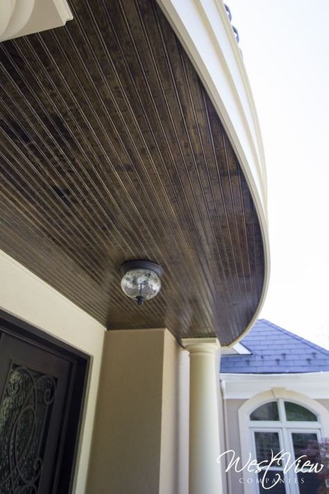 Dark stained beadboard on the ceiling of the portico gives a little contrast to this sophisticated Dark Stained Porch, Dark Beadboard, Stained Porch, Stained Beadboard, Patio Ceiling Ideas, Patio Ceiling, Porch Ceiling, Beadboard Ceiling, Dark Stains