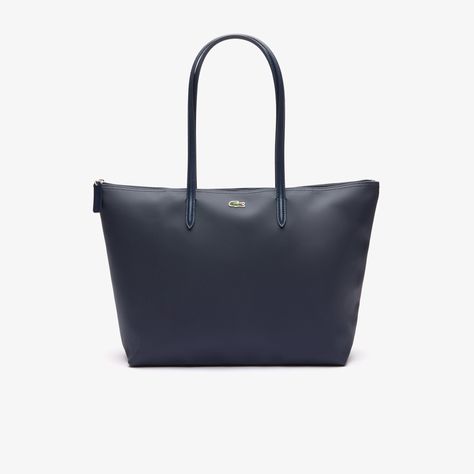 This large, lightweight zipped tote is big enough to hold a 15” laptop. The star of the L.12.12 Concept collection, featuring an embossed piqué effect inspired by the iconic Lacoste polo from 1933. The wide handles are pointed at the ends in a subtle nod to golf tees. Lacoste Bag, Sac Tote Bag, Business Laptop Bag, Polo Lacoste, Lacoste Polo Shirts, Lacoste Women, Lacoste Polo, Golf Tees, Zip Tote