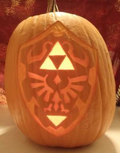 Pin for Later: 27 Geeky Pumpkins to Inspire Your Halloween Decor Hylian Shield From Zelda Pumpkin Zelda Pumpkin, Pumpkin Carving Patterns Free, Easy Pumpkin Carving, Pumpkin Carving Designs, Pumpkin Template, Pumpkin Carving Patterns, Pumpkin Carvings Stencils, Pumpkin Carving Templates, Pumpkin Stencil