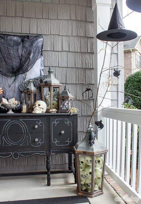 You can't go wrong with a witchy black-and-white theme for your Halloween porch decor. Come see how we created a spooky setting for trick or treating using vintage items, dollar store finds and things from the yard. Witchy Porch Decor, Witchy Front Porch, Spooky Basket Ideas, Halloween Porch Decorations Diy, Outdoor Decorations Halloween, Porch Urns, Outdoor Witch, Halloween Doors, Halloween Porch Decor