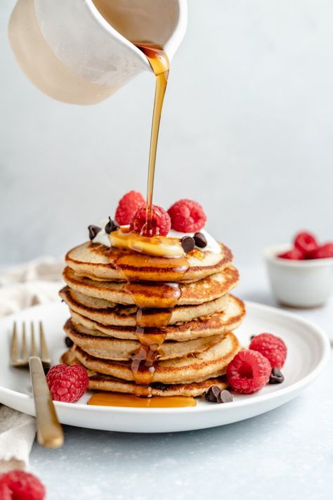 Incredibly fluffy yogurt pancakes made right in the blender with protein-packed greek yogurt and oats. These easy, gluten free oatmeal yogurt pancakes make a wonderful weekday breakfast or delicious weekend brunch! Add your favorite mix-ins and a drizzle of maple syrup for the perfect morning. #pancakes #brunch #breakfast #glutenfree #yogurt Oatmeal Yogurt Pancakes, Fluffy Yogurt, Fluffy Coconut Flour Pancakes, Oatmeal Protein Pancakes, Morning Pancakes, Oatmeal Yogurt, Banana Oatmeal Pancakes, Greek Yogurt Pancakes, Yogurt Pancakes